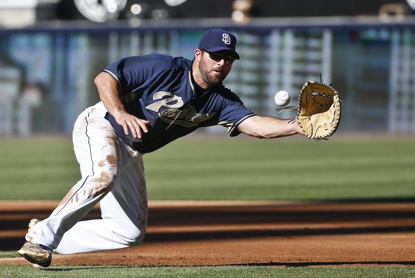 San Diego Padres first baseman Cody Decker fields a ball during infield practice 