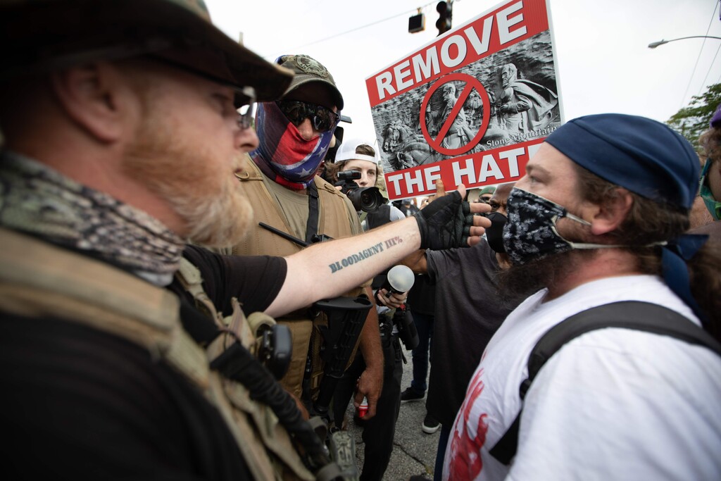 Anti-racist and anti-facist protester faces against far right militias and white pride organization in U.S.