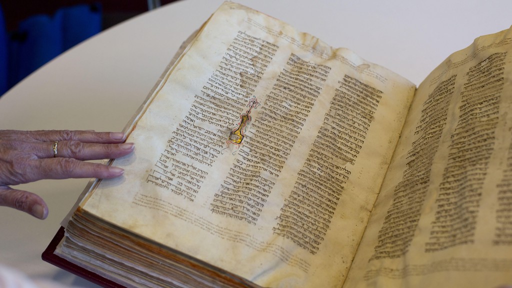A library official shows a Jewish manuscript smuggled into Israel from Damascus in a Mossad spy operation in the early 1990s