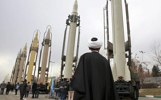 An Iranian clergyman looks at domestically built surface to surface missiles displayed by the Revolutionary Guard in a military show marking the 40th anniversary of the Islamic Revolution, at Imam Khomeini Grand Mosque in Tehran, Iran, February 3, 2019 