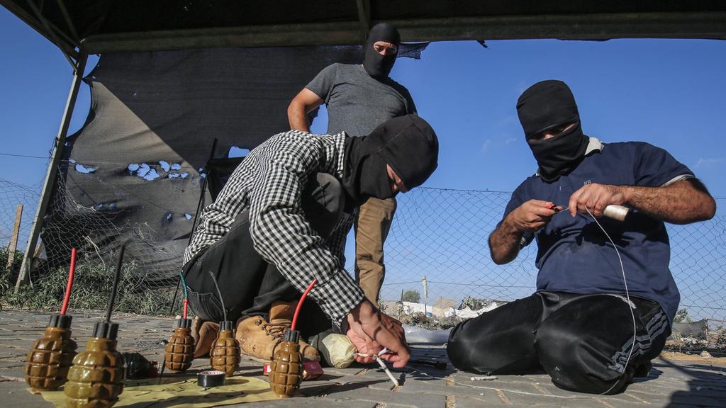 Hamas operatives preparing incendiary balloon clusters in Gaza 