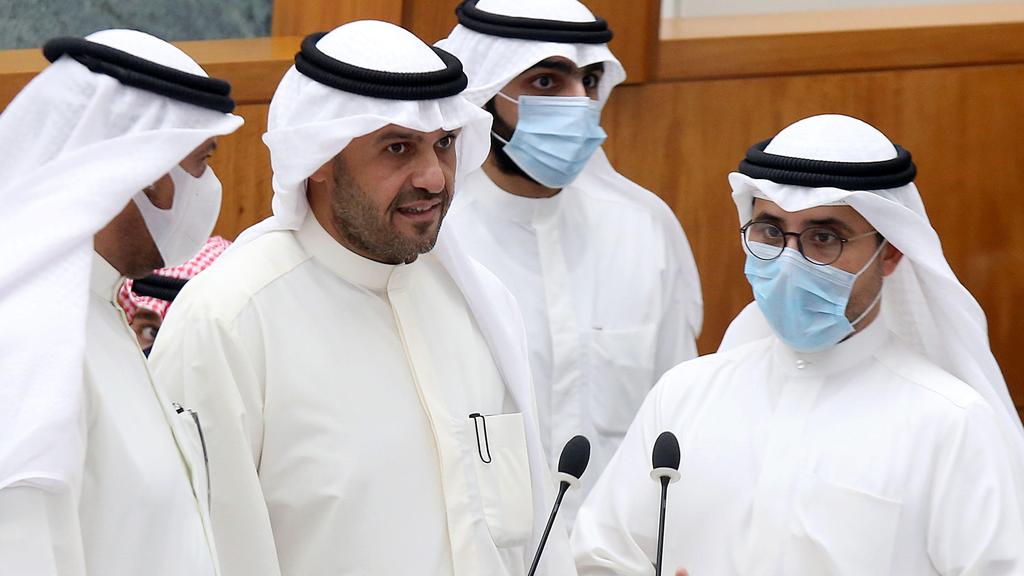  Kuwaiti Foreign Minister Sheikh Ahmad Nasser al-Sabah, Interior Minister Anas al-Saleh and Awqaf Minister Fahad al-Afasi attend a parliament session at the national assembly in Kuwait City