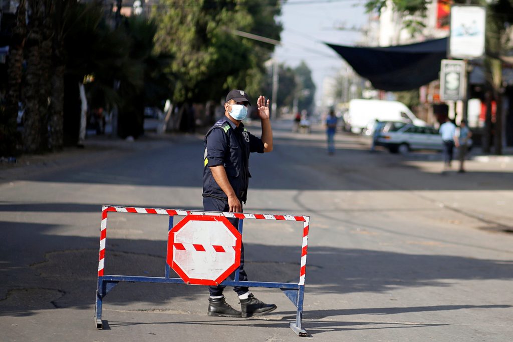 Police road block during lockdown in Gaza (Photo: Reuters) Police road block during lockdown in Gaza