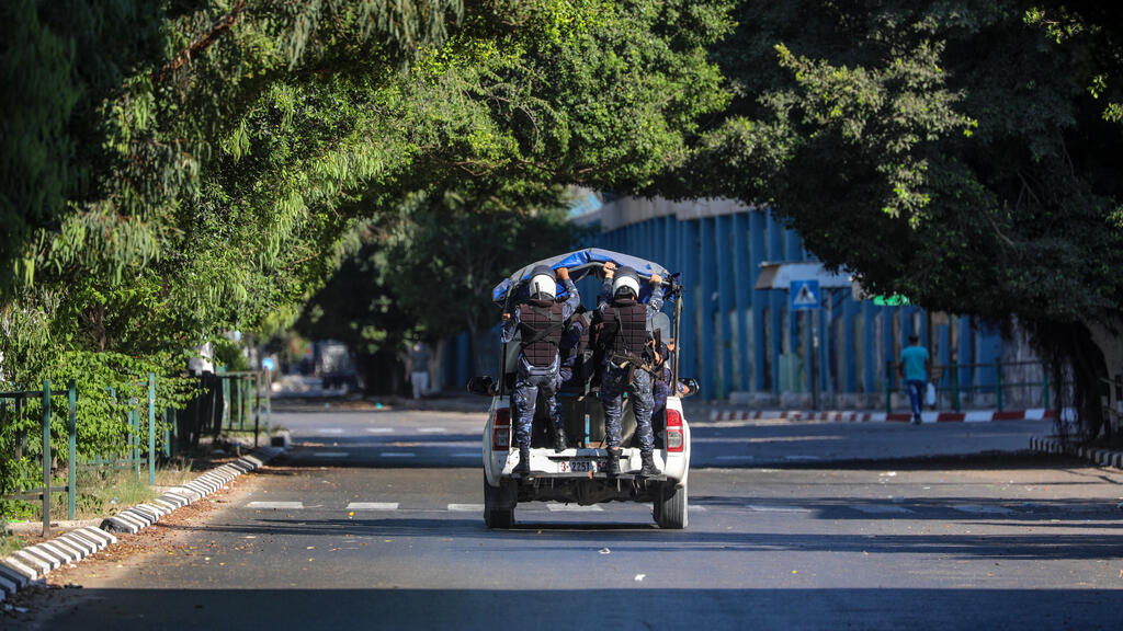 Palestinian Hamas policemen patrol on empty streets amid the ongoing coronavirus COVID-19 pandemic in Gaza