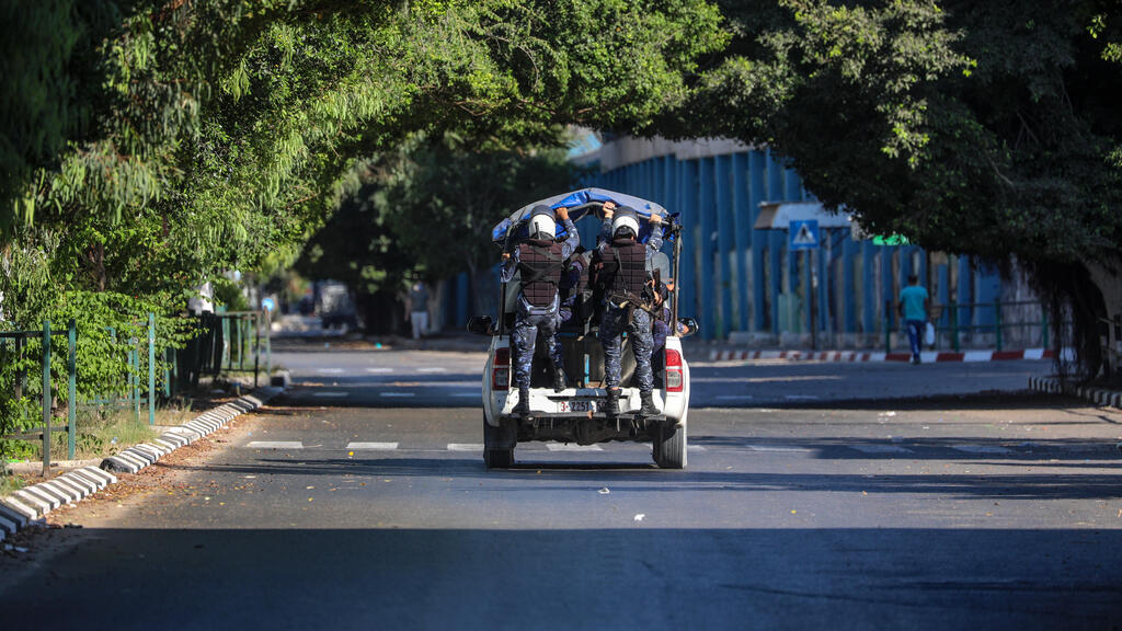 Palestinian Hamas policemen patrol on empty streets amid the ongoing coronavirus COVID-19 pandemic in Gaza