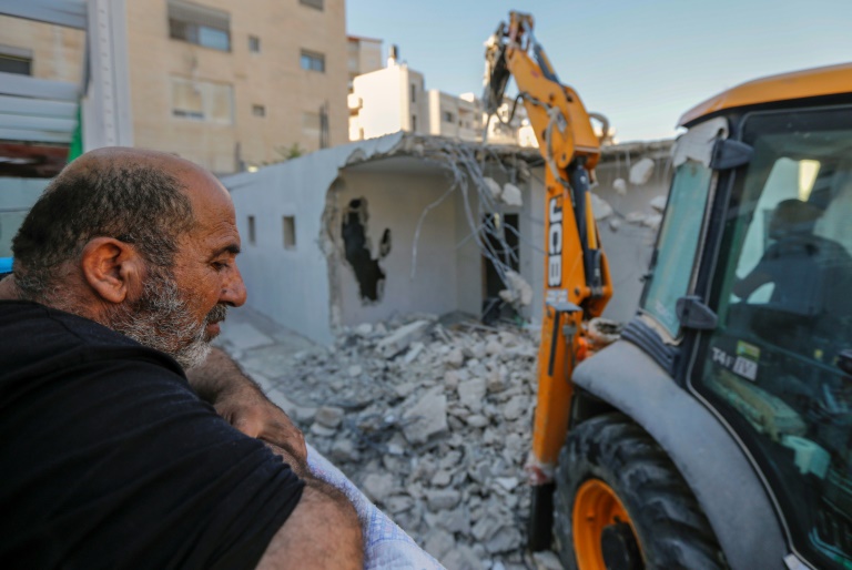 Palestinian home owner watches house built without permit razed in East Jerusalem
