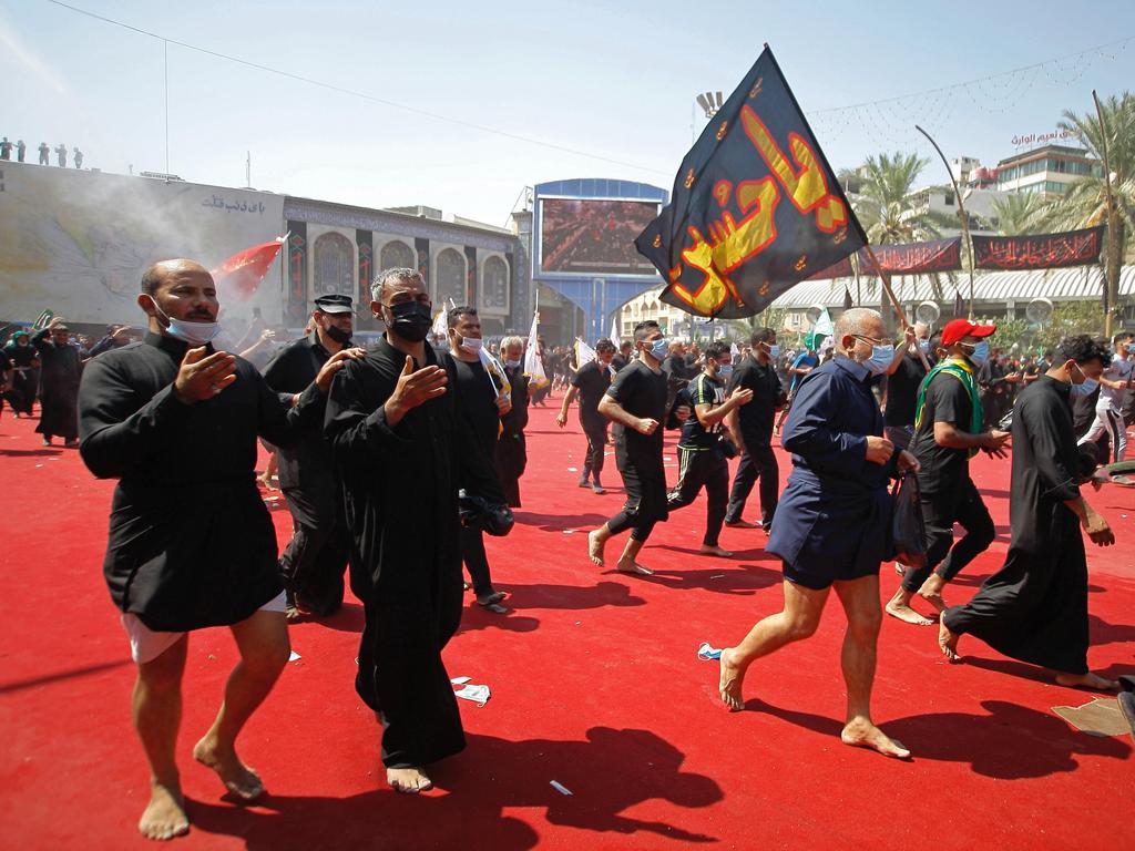 Shiite Muslim worshippers gather outside the holy shrine of Imam Hussein during Ashoura in Karbala, Iraq 