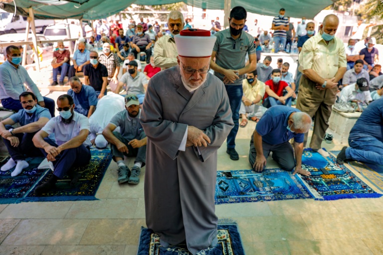 Palestinian Muslim cleric heads prayers in protest tent set up by activists against demolition of houses by Israeli authorities in East Jerusalem