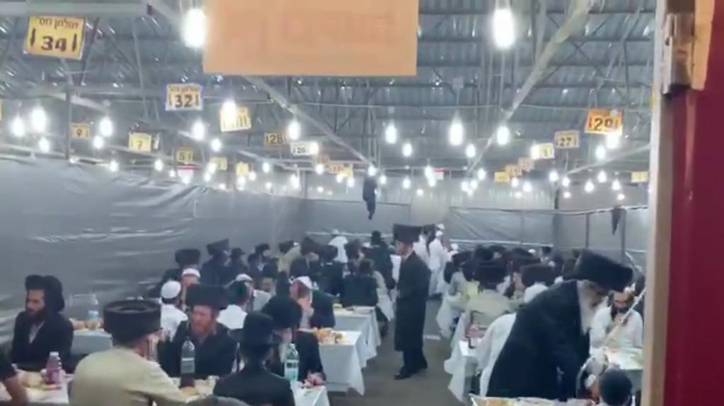  Dozen Ultra-Orthodox pilgrims in Uman, dining together in spire of regulations