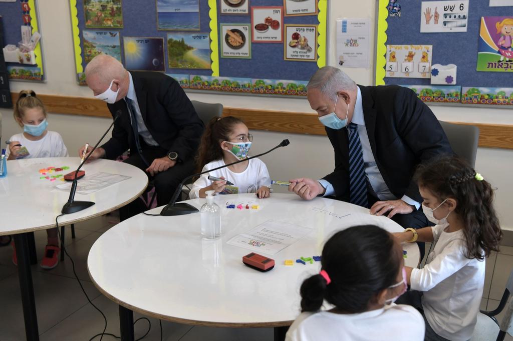 Prime Minister Benjamin Netanyahu, right, and Education Minister Yoav Galant, join first graders at the start of the school year in the West Bank settlement of Mevo Horon (Photo: GPO) Prime Minister Benjamin Netanyahu, right, and Education Minister Yoav Galant, join first graders at the start of the school year in the West Bank settlement of Mevo Horon