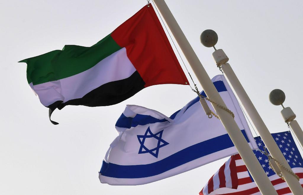 The Emirati, Israeli and US flags sway in the wind at the Abu Dhabi airport