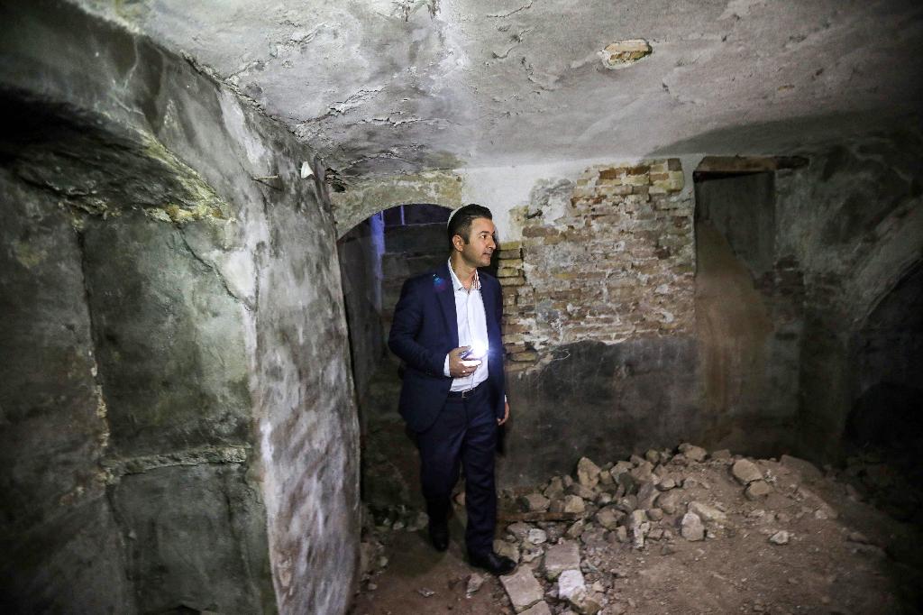 Ranj Abderrahman Cohen, an Iraqi Kurdish Jewish man, stands at a ruined Jewish synagogue in Arbil, the capital of the autonomous Kurdish region of northern Iraq, on July 5, 2020