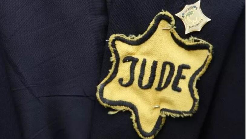 A Nazi-era yellow Star of David bearing the word "Jew" (Photo: AFP) A jacket belonging to the late Polish-born Holocaust survivor Mordechai Fuchs