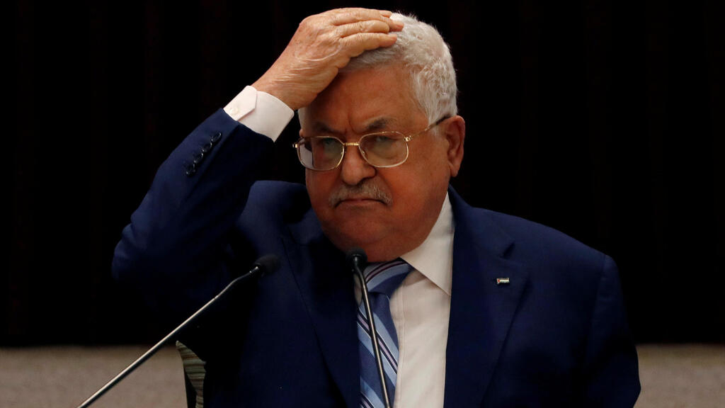 President Mahmoud Abbas gestures during a meeting with the Palestinian leadership to discuss the United Arab Emirates' deal with Israel to normalize relations