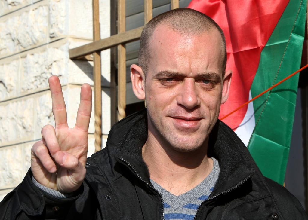 Salah Hamuri, a French-Palestinian, flashes a victory sign outside his home in Dahyat al-Barid near the West Bank city of Ramallah 