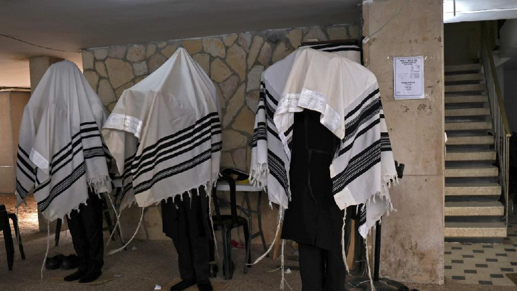  Religious Jews pray outdoors in Bnei Brak 
