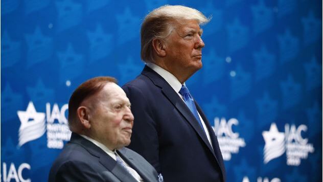 resident Donald Trump stands alongside Sheldon Adelson
