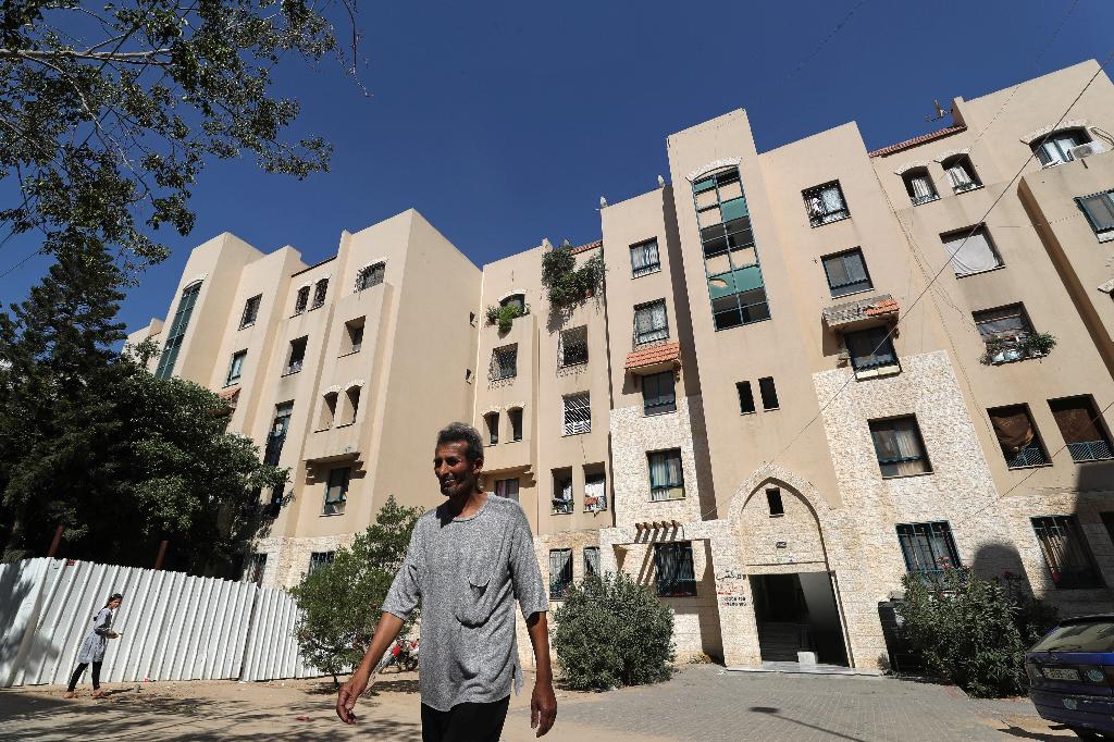 Palestinian man Maher Hmaida walks at the Sheikh Zayed housing estate in the northern Gaza Strip
