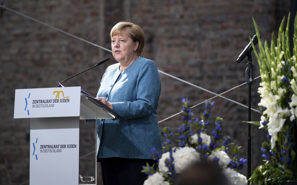 Chancellor Angela Merkel speaks at the ceremony to mark the 70th anniversary of the Central Council of Jews in the courtyard of the New Synagogue in Berlin, Germany 