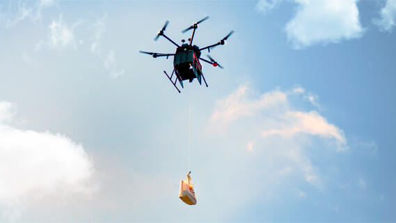 A Flytrex drone delivering a package