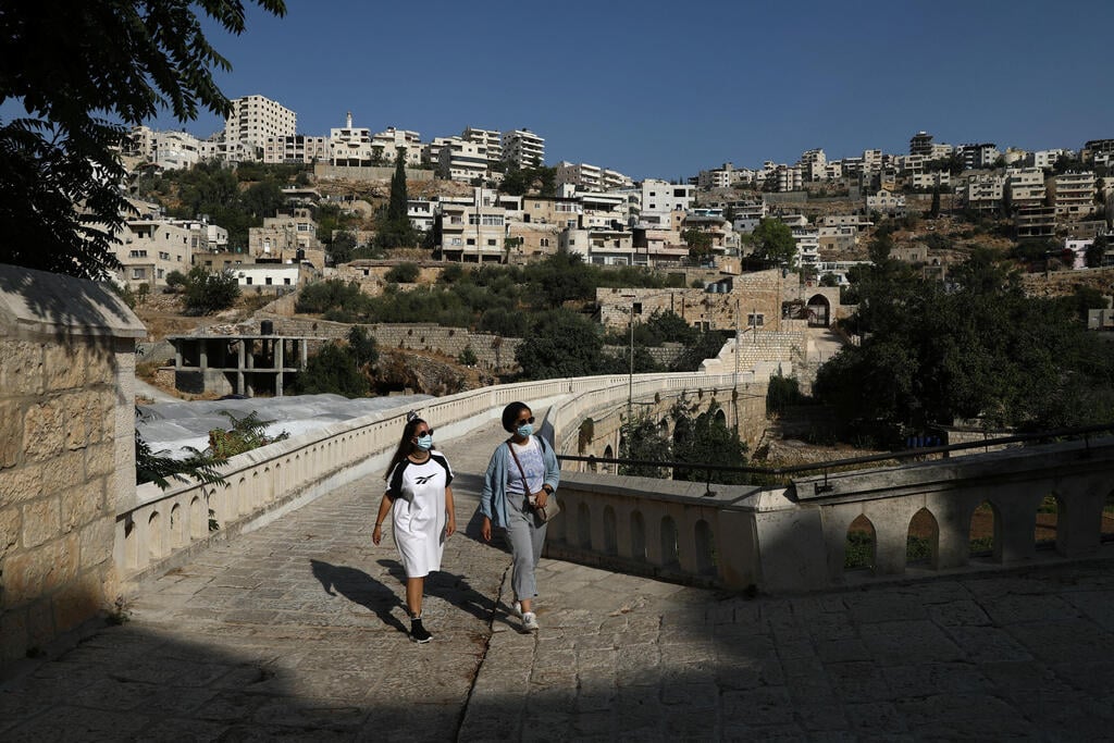 oung Palestinian travel bloggers Malak Hasan and Bisan Alhajhasan arrive at the Convent of the Hortus Conclusus in Artas village near Bethlehem in the West Bank