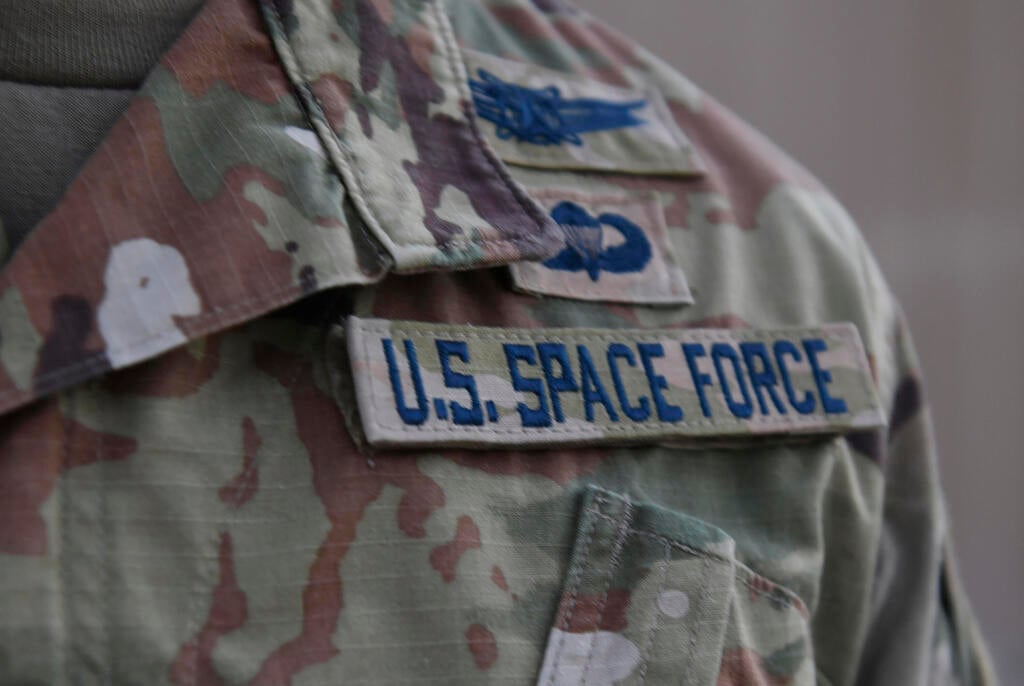 Capt. Ryan Vickers stands for a photo to display his new service tapes after taking his oath of office to transfer from the U.S. Air Force to the U.S. Space Force at Al-Udeid Air Base, Qatar 