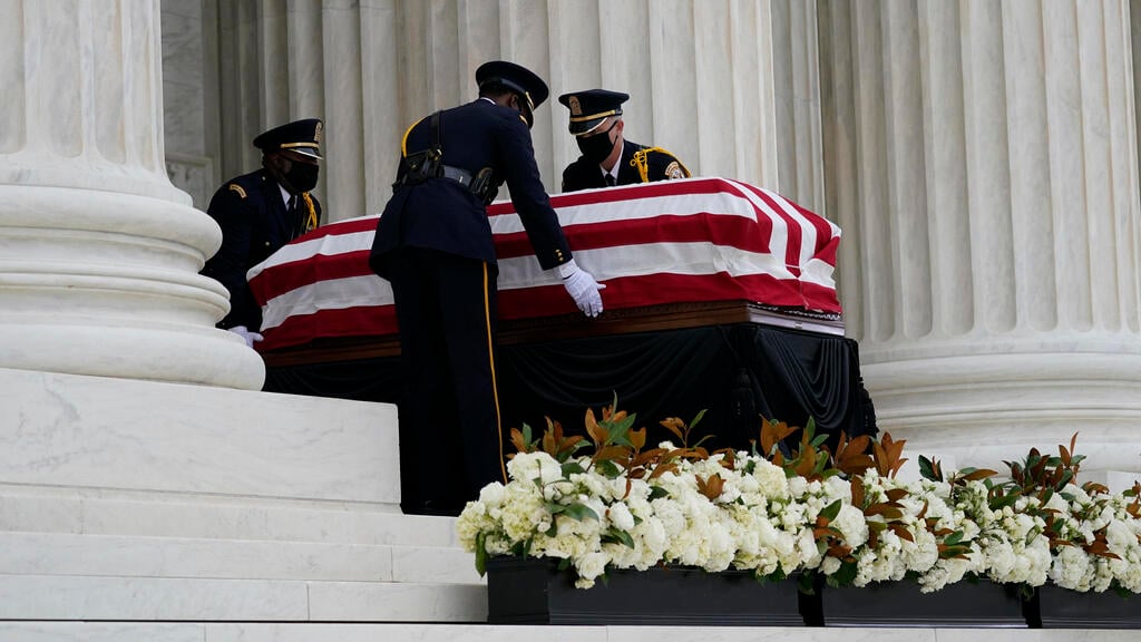 The flag-draped casket of Justice Ruth Bader Ginsburg lies in repose at the Supreme Court building 