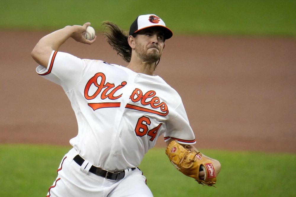 Baltimore Orioles starting pitcher Dean Kremer delivers during the first inning of the team's baseball game against the Boston Red Sox 