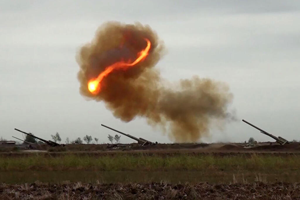 allegedly shows Azeri artillery strike towards the positions of Armenian separatists
