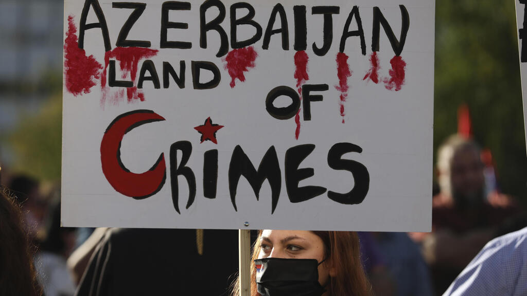 Armenians who live in Greece take part in a rally in Athens against Azerbaijan 