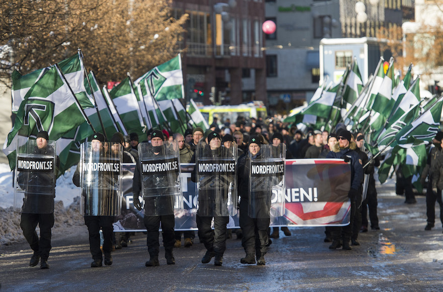 Nordic Resistance Movement sympathizers participating in an anti-immigrant demonstration in central Stockholm