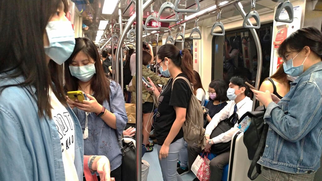 People wear face masks to protect against the spread of the coronavirus as they ride the subway in Taipei, Sept. 29, 2020 