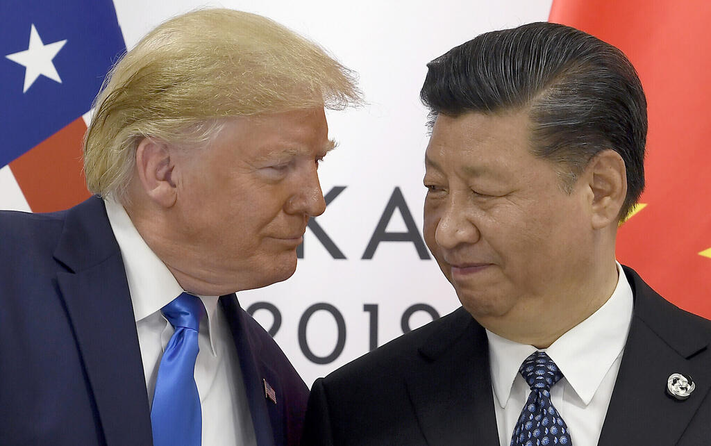U.S. President Trump with Chinese leader Xi during a meeting on the sidelines of the G-20 summit in 2019 