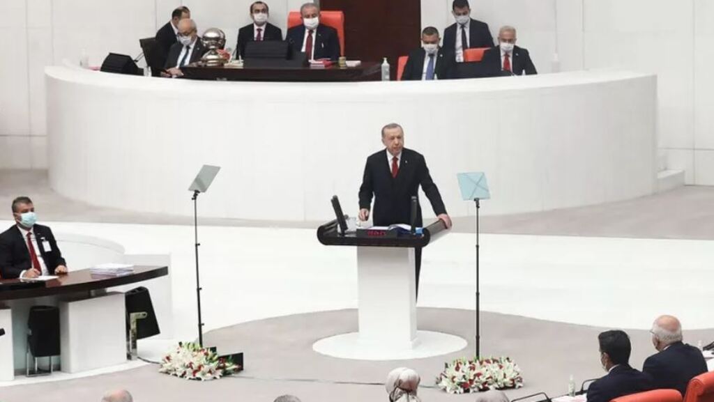 Turkey's President Recep Tayyip Erdogan (center) addresses MPs at the fourth legislative session of the Turkish parliament'