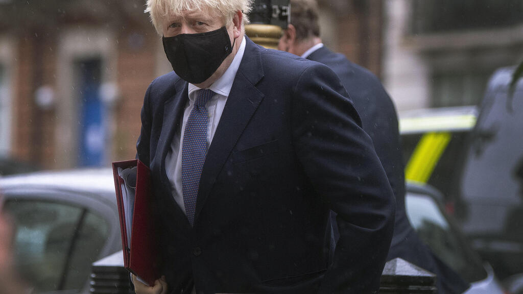  British Prime Minister Boris Johnson with a mask 