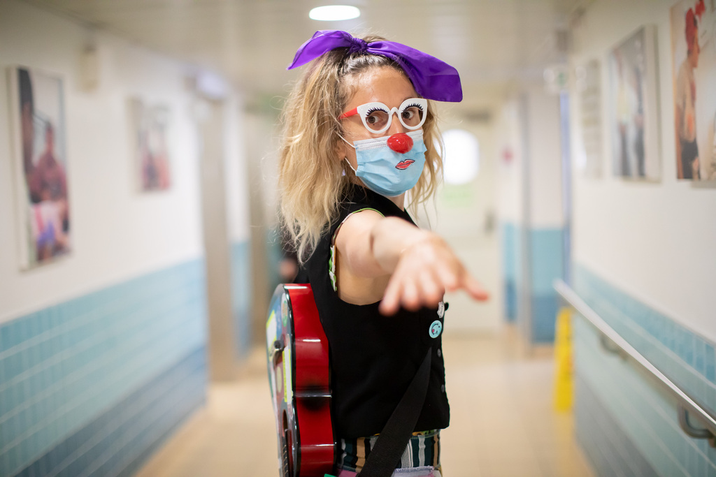 A medical clown tries to bring some cheer to sick children at Bnai Zion 