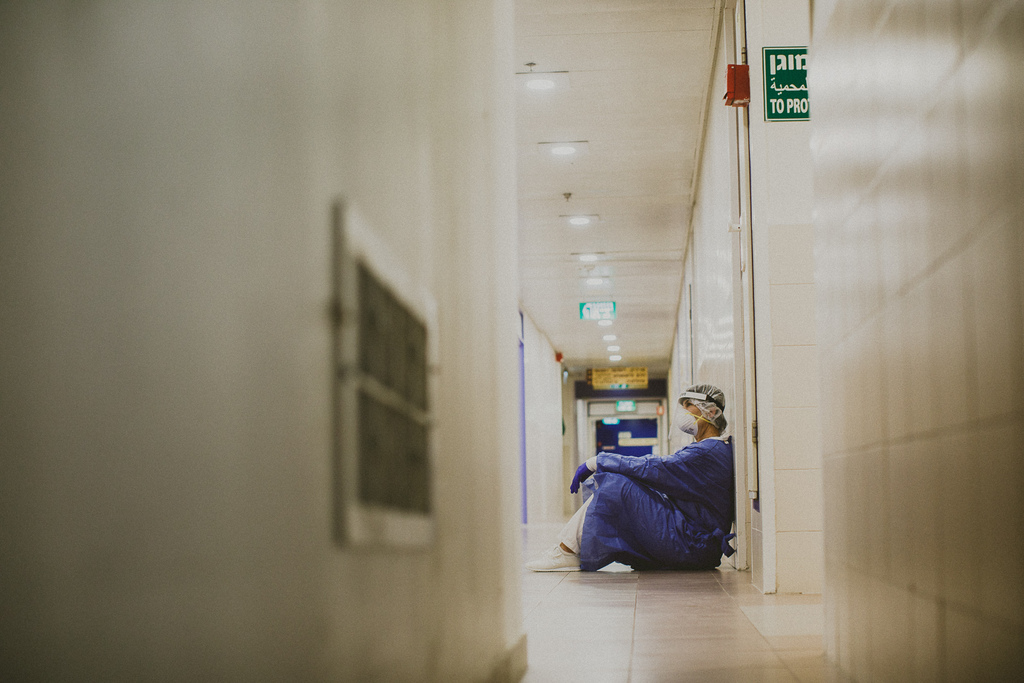 A lab technician rests in a hallway at Haifa’s Bnai Zion Medical Center 