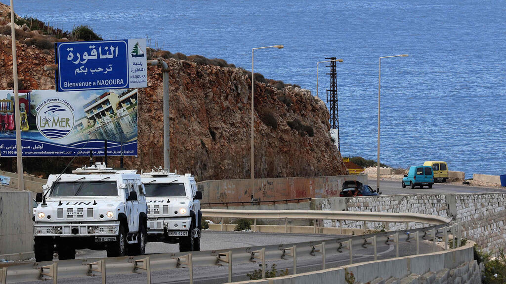 United Nations peacekeeping force (UNIFIL) vehicles patrol the coastal road to Naqura, the southernmost Lebanese town by the border with Israel,