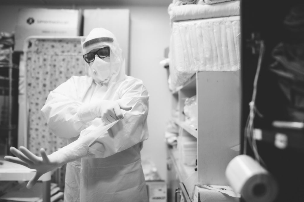 A hospital worker dons protective gear at Bnai Zion Medical Center during the first wave of the coronavirus pandemic 