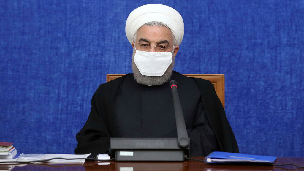 נשיא איראן חסן רוחאני בדיון על ה קורונה בארצו עם מסכה