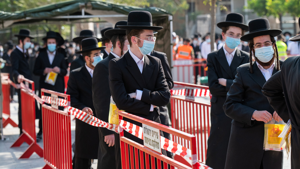 Yeshiva students waiting in line in Jerusalem to get tested for the virus 