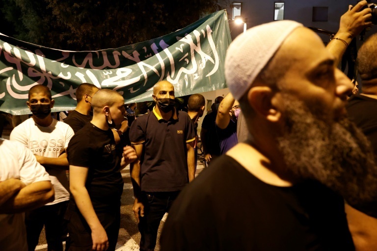 Arab-Israeli protesters gather outside the residence of the French Ambassador to Israel, in Tel Aviv 