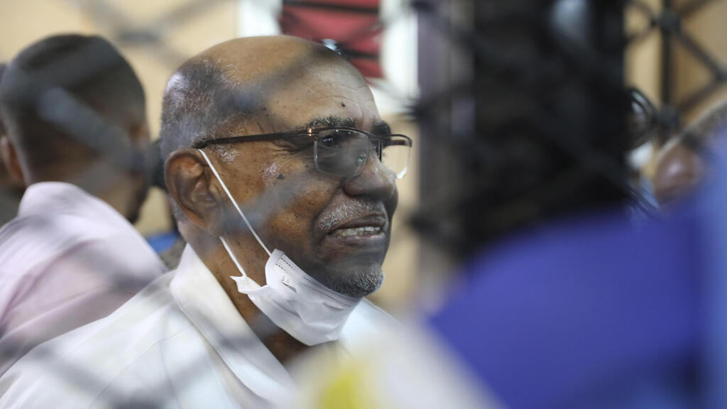  Sudan's ousted president Omar al-Bashir sits at the defendant's cage during his trial a courthouse in Khartoum