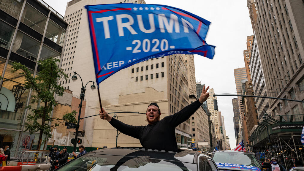 A person participates in a march and rally for President Donald Trump on 5th Avenue on October 25, 2020 in New York City 