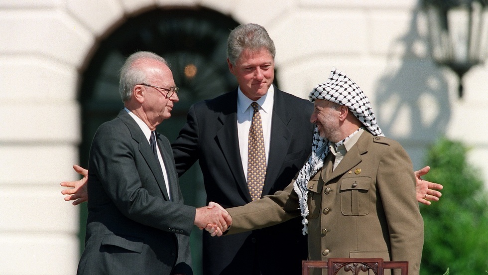 Yitzhak Rabin, Bill Clinton and Yasser Arafat during the signing of the Oslo accords in 1993 