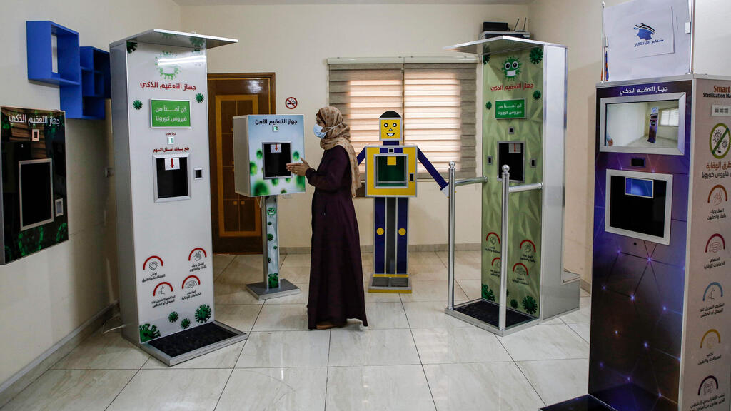 Palestinian entrepreneur Heba al-Hindi demonstrates a locally-designed and manufactured smart sterilisation device in Gaza 