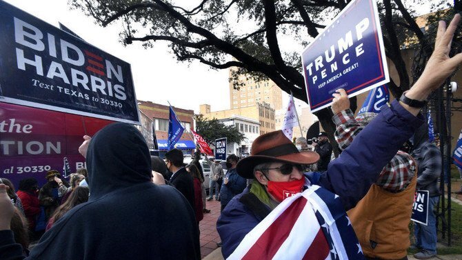 Supporters President Donald Trump come face-to-face with Biden-Harris campaigners during a Democratic ticket stop at Vera Minter Park in Abilene, Texas 