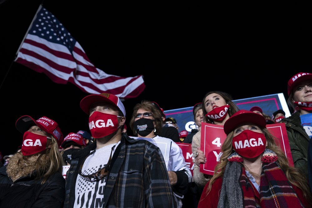 Supporters of President Donald Trump listen to him speak during a campaign rally at Richard B. Russell Airport, Sunday, Nov. 1, 2020, in Rome, Ga. 