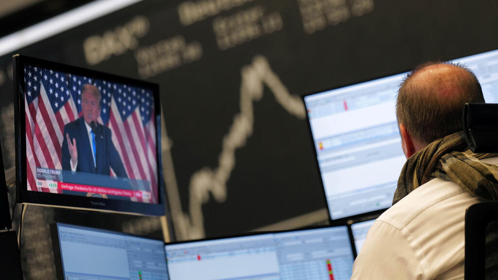 U.S. President Donald Trump is seen on a TV screen at the stock exchange in Frankfurt, Germany