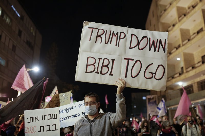 A sign held  by anti-Netanyahu demonstrators in Jerusalem on Saturday 